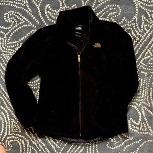 NorthFace Black fleece With gold accents.